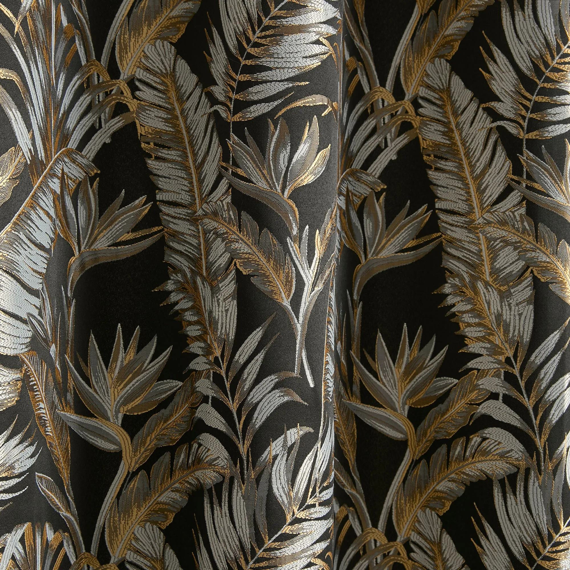 Paradise Palm Pair of Eyelet Curtains by Laurence Llewelyn-Bowen in Black